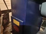 a blue machine that is sitting in a room