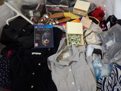a pile of clothes and other items in a bin