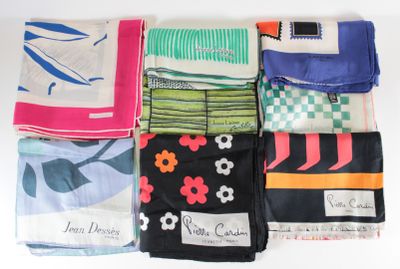 several different types of scarves laid out on a white surface