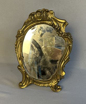 a mirror that is sitting on a table