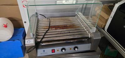 an image of a hot dog grill on a counter top