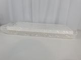 a mattress that is wrapped in plastic on a table