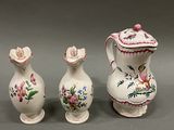 three vases that have been painted with flowers on them