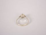 a close up of a ring on a white surface