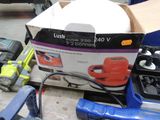 a box of tools sitting on a table next to a box of tools