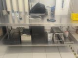 a stainless steel table with a bunch of items on it