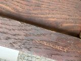 a close up of a wooden bench with writing on it
