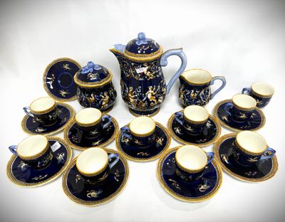 many cups and saucers that are sitting on a table