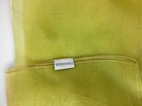 a close up of a yellow shirt with a label on it
