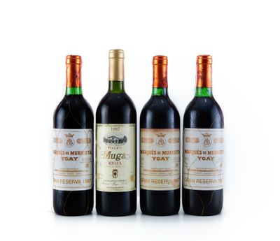 trois bouteilles de vin sont alignées sur une surface blanche