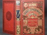 un vieux livre à la couverture rouge posé sur une table