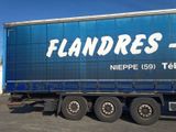 a large semi truck that is parked in a parking lot