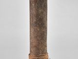 a wooden pole with a rope wrapped around it