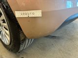 a close up of a car with a sticker on it ' s bumper