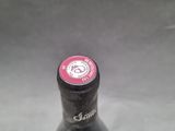 a bottle of beer that is sitting on a table