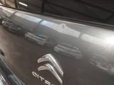 a close up of a car ' s emblem on the side of the car