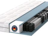 une photo d'un matelas sur lequel a été posé un surmatelas