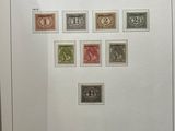 a framed picture of a collection of stamps from the netherlands