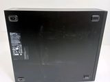 the back of a black box on a white surface with a white background