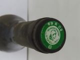 a close up of a bottle of wine on a door handle