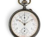 a close up of a pocket watch on a white background