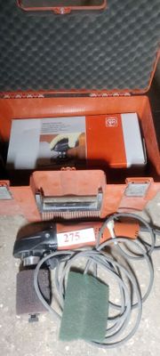 a tool in a case that is sitting on the floor