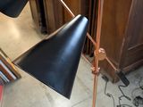 two lamps that are on a stand in a room