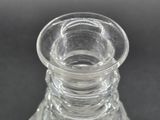 a clear glass vase that is sitting on a table