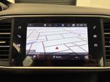 the dashboard of a car with a gps device in the center