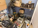 a room filled with lots of old items and tools
