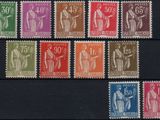 a close up of a group of different colored stamps on a black surface
