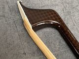 a wooden axe that is laying on the floor