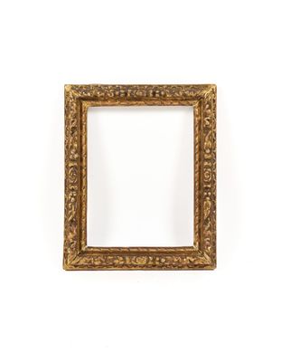 an old gold frame with a decorative pattern on it