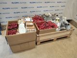 boxes of assorted electrical components are sitting on a floor