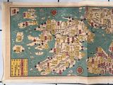 an old map of the world is displayed on a tile floor