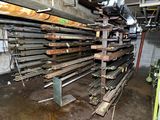 a large amount of steel bars stacked up in a warehouse