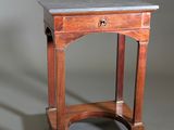 a small table with a marble top on it