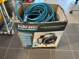 a box that has a hose in it on the floor