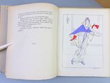 an open book with a drawing of a woman holding a kite