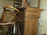 a wooden chair and a wooden bench in a room