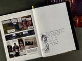 an open book with a picture of a man and a woman