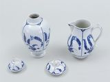 a small white and blue vase and a small blue and white pitcher