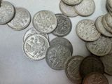 a lot of coins that are on the table