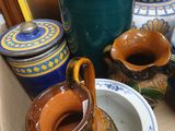many vases and bowls in a box on the table
