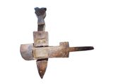 a large metal object with a hammer on top of it