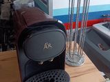 a coffee machine sitting on top of a wooden counter
