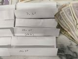 a pile of money sitting on top of a table