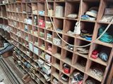 a shelf with many different types of shoes on it