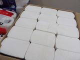 a box full of white toilet paper sitting on a table