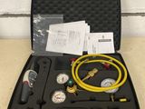 an image of a case with a hose and gauges in it